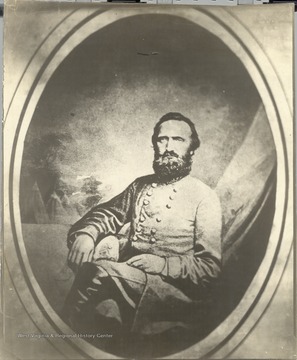 Portrait of Stonewall Jackson seated in a chair.