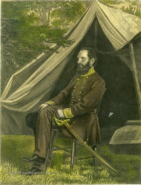 Portrait of Thomas J. Jackson in a chair outside of his tent with his sword.