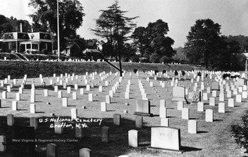 A section of the National Military Cemetery at Grafton. The tall shaft at the extreme right marks the grave of Bailey Brown, 2nd West Virginia Infantry, the first man killed by an enrolled Confederate soldier in the Civil War.  See West Virginia Collection Pamphlet 6610 and Boyd Stutler's 'WV in the Civil War.'