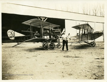 Aircraft in foreground is a "grass cutter" or "penguin," a non flying training machine designed to teach student pilots of the day start up and taxi procedures.  Rear aircraft is Curtiss JN-4, aircraft #1 of WV Flying Corps. See Louis Bennett letter to Gov. John J. Cornwell, 22 June 1917, WV State Archives, Charleston, Box 302.  Note:  Aircraft #1 was destroyed in a crash on 3 August 1917.  See Wheeling Register, 4 August 1917, front page. 