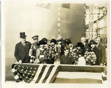 Group portrait of Governor Ephraim Franklin Morgan, Alice Wright Mann, and others at the christening of the U.S.S. West Virginia.