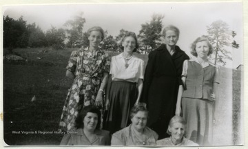 Group portrait of members of the Mt. Zion Farm Women's Club, in Pocahontas County, who prepared the exhibit 'Lines to Lighten Labor' for the 1947 County Fair.