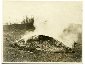 Smoke rising from a burning lime kiln on the farm of W.A. Loar, Monongalia County near Laurel Point.