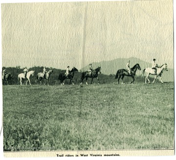 Picture of seven people riding horses in the West Virginia mountains. 