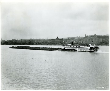 Pittsburgh Coal Co. towboat with a load of coal outside of an unknown city. Reorder No. from Judge is 31540-1.