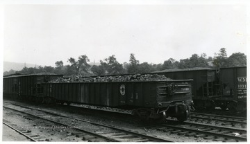 Western Maryland Coal Car No. 50519 with other cars in background.