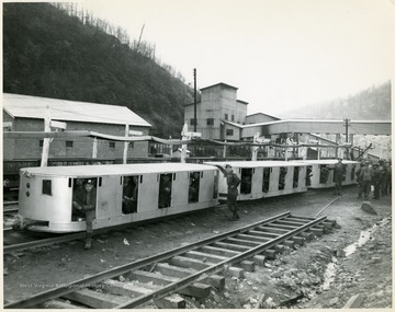 Miners in Safety Cars for transportation into the mine, Winding Gulf Collieries.