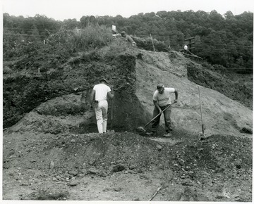 Men digging into the mound.