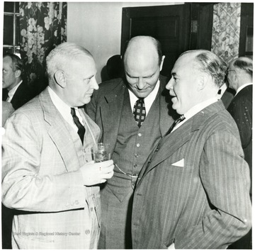 Three coal officials talking during a Consolidation Coal Co. Inspection trip.