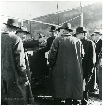 Coal officials talking outside during a Consolidation Coal Co. Inspection trip.