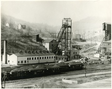 Headframe, plant, and train cars at former Four States Mine.