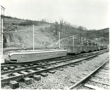Filled coal cars being driven out of mine during a Consolidation Coal Co. Inspection trip.