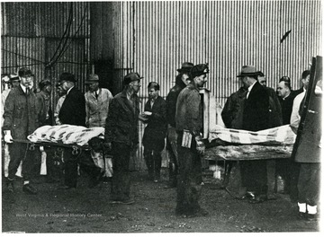 Miners carry out the bodies of those killed in an explosion at a Bartley, W. Va. mine.