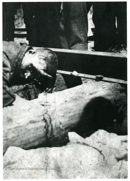 Body of a miner killed an explosion lying next to train track.