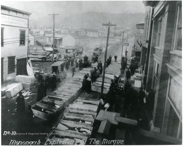 Caskets line the street which served as a makeshift morgue for the miners killed in the explosion at the Fairmont Coal Company Monongah Mines. 
