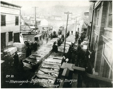 Caskets line the street, a makeshift morgue for the miners killed in the explosion at Fairmont Coal Company's Monongah Mines. 