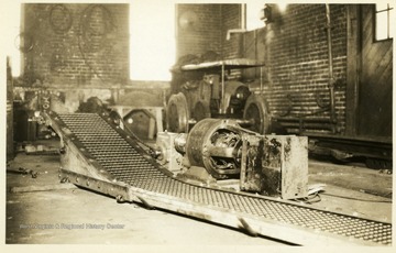 Close view of a conveyor and engine at a coal mine machine shop in Thomas, W. Va.