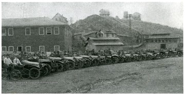 Line of cars filled with miners. Picture copied Feb. 1979 from Coal Age, Vol 9, 1916 Jan-June. From article "Raleigh Mining Institute, Department of Human Interest," June 3, 1916, issue, pix page 977, top.