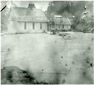 Water surrounds the Methodist and Baptist churches after a flood at Louisville Coal and Coke Co., Goodwill, W. Va.