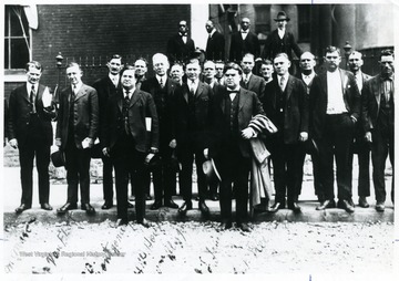 Group portrait of United Mine Workers leaders and lawyers at Jefferson County Courthouse, W. Va. Front Row, Left to Right; James M. Mason, C. J. Van Fleet, Samuel B. Montgomery, Harold Wilkins Houston, William Blizzard, John L. Lewis, Charles Franklin Keeney.