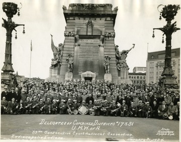 Delegates of combined districts No. 17 and 31 of the U.M.W.A. pose for a group portrait.  Members of the District 31 W. Va. U.M.W.A. Band kneeling at front.