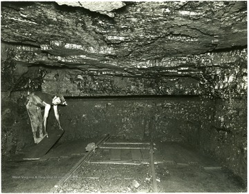 Miner placing boards in Cavalier Mine No. 206.