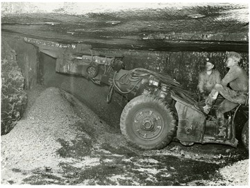Two miners at Pursglove No. 15 cut coal preparatory to shooting it down for loading.