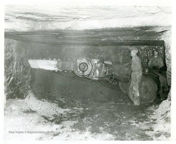Miners work with a cutting machine prior to 'shooting down' coal at Pursglove No. 15.