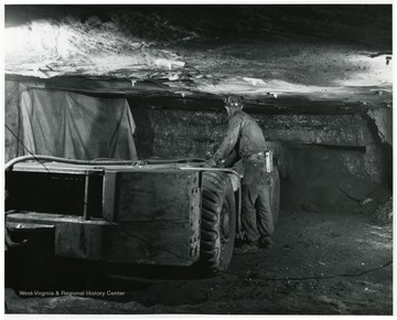 A modern coal cutting machine in operation at Bishop Mine.
