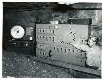 Miner works at the control panel at Jamison No. 9.