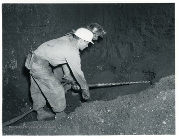 Miner drilling holes for explosives at Jamison No. 9.