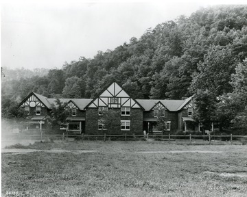 'Front view of one of several blocks of apartments at Coalwood, W. Va., Carter Coal Co.' 'Notice: Permission is granted to reproduce this photograph only on the condition that each reproduction shall bear the following credit line: Norfolk and Western Railway.'