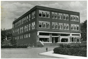 Large building along a paved street.