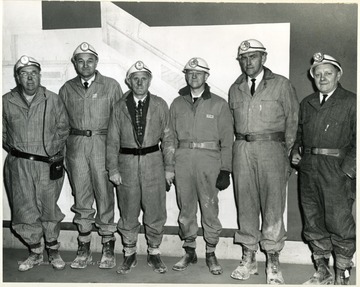 Group Portrait of miners. Left: Dean Holland, Ernest Nesius (VP), Harry Hoflin (VP), Roman  Verhoalen (Dean of Extension), John Golay (Provost)