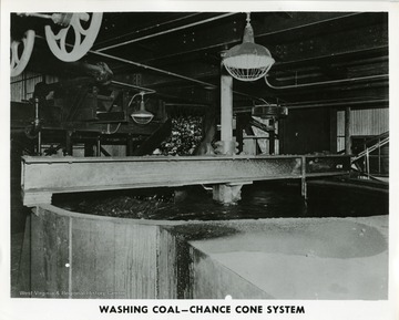 Coal loading into a wash tub.