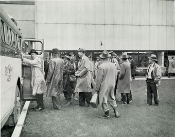 Visitors getting back onto the buses at the Georgetown Preparation Plant.