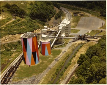 Color photograph showing the preparation plant and painted silos next to it. John Williams / Coal Life Project.