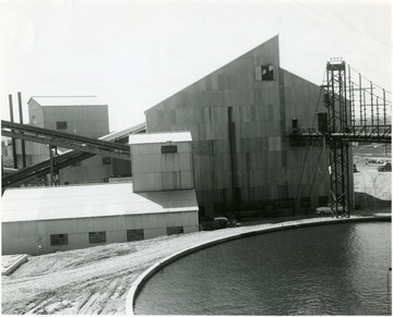 Pump Station No. 1 at left, Crushing Plant. In the foreground is one of three storage pools that feed to the pipe line.