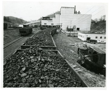 A coal train lines up in front of the preparation plant.