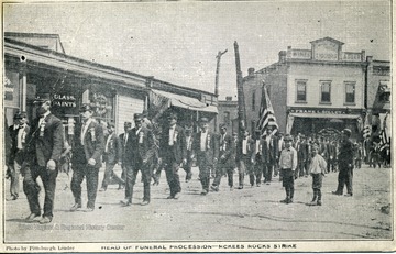 Pressed Steel Car Co.'s Strike. Funeral procession passing George and Helen streets. Several thousand men took part and marched ahead of the hearses containing bodies of strikers killed in battle of Aug. 22, 1909.