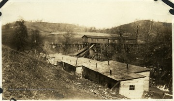 Barracks with a coal building in the background.