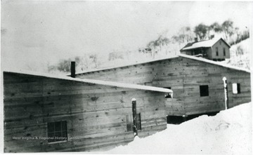 Barracks and house with snow on ground at Flemington, W. Va.