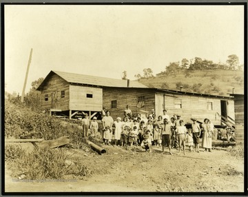 Miners families in front of a barrack at Kennedy Hill, Everson, W. Va.