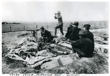 Men using a machine gun during the Ludlow Strike.  