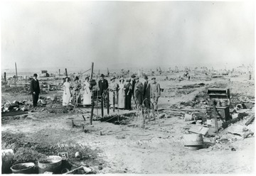 The Red Cross Society stands in the remains of Ludlow.