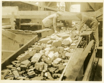 'Interior of tipple showing coal on picking table and loading boom.'