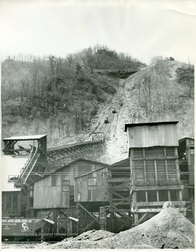 Stanaford Tipple loading coal cars.  Coal cars moving up and down hill on tracks.