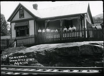 Staff of the New River Company standing on the porch of their interim office building in McDonald, W.Va.  Later moved to Mt. Hope.