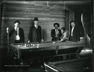Five men play pool in Glen Jean or Thurmond, W. Va.