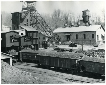 Coal loading area.  Cars going under a tipple.  